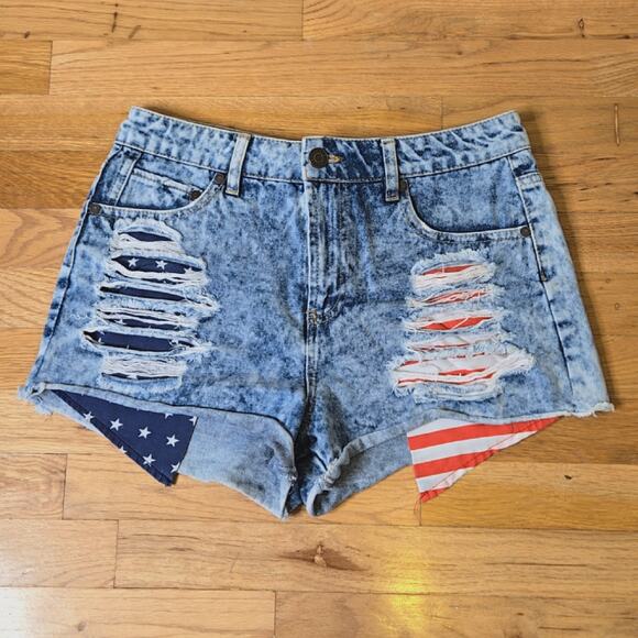 refuge Pants - Refuge Denim cut-off shorts with distress and flag print pockets size 8